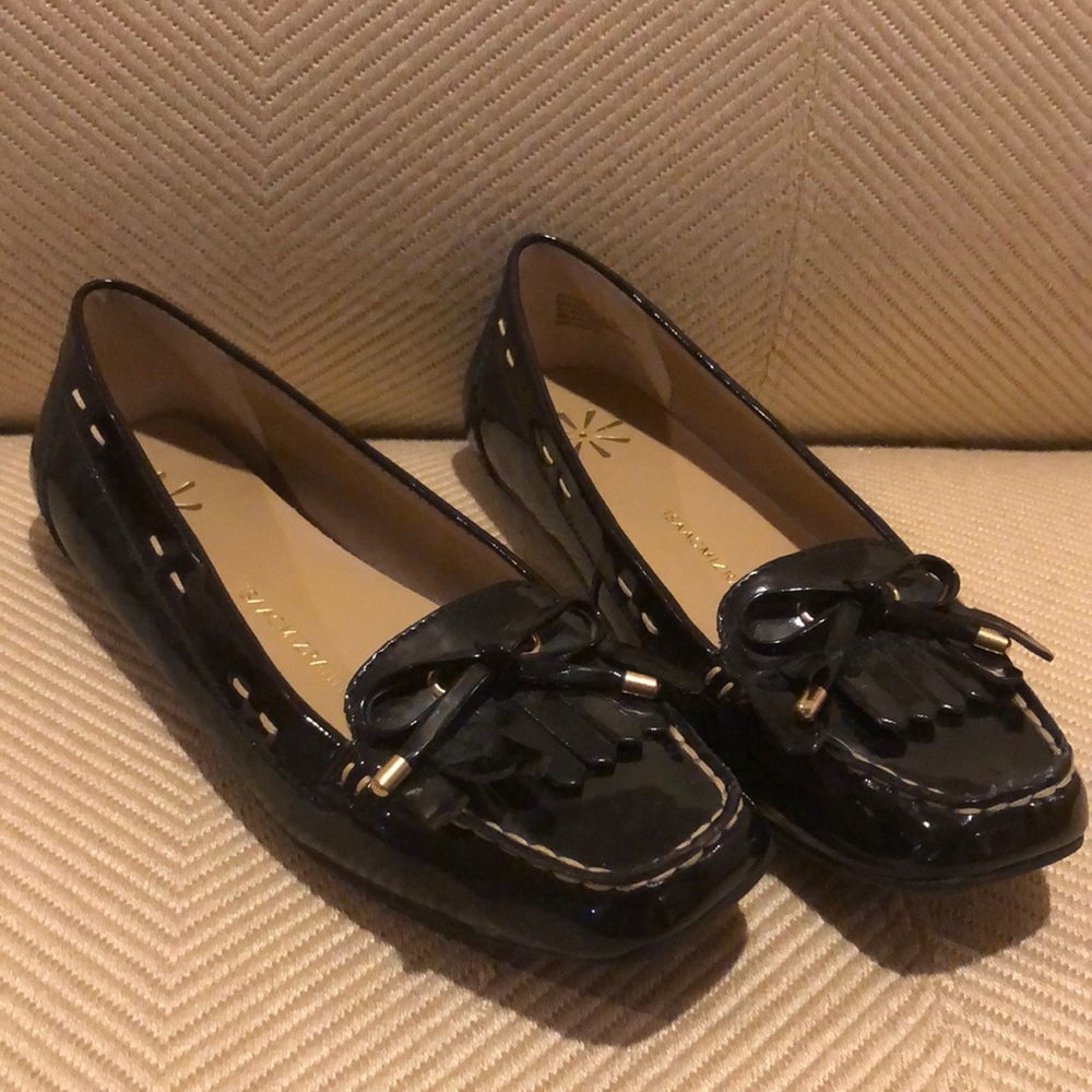 Black flats with tassels